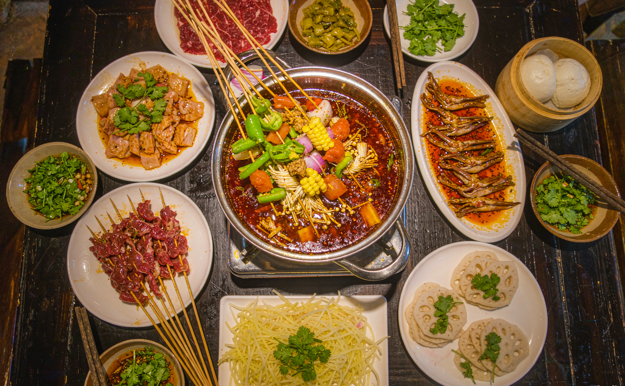 Chengdu night food alley with skewers and bubbling Sichuan hotpot