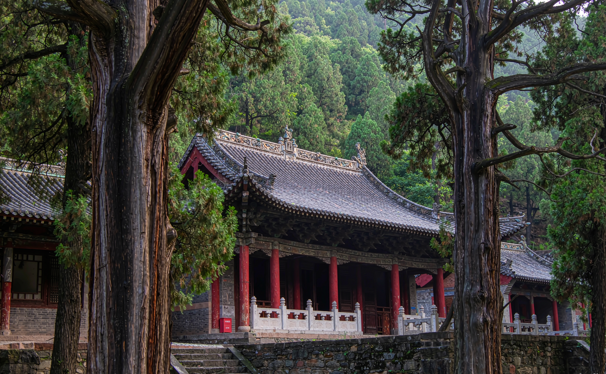 A quiet lane through Weishan ancient town Yunnan at dawn with grey tiled roofs