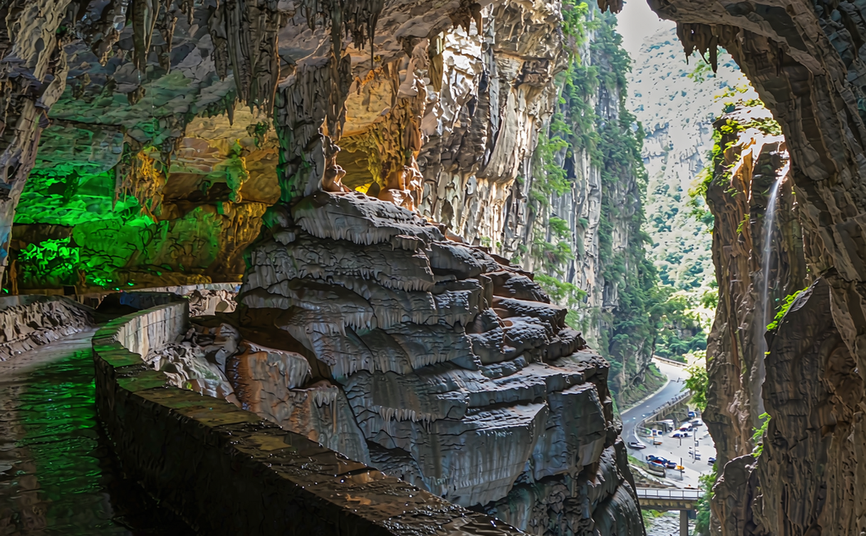The Tianlong natural bridge arching over a green karst valley in Wulong, Chongqing, China
