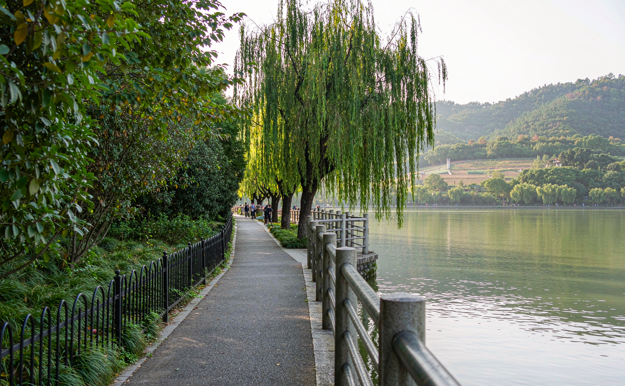 Qionghai Lake boardwalk with fishing boats at dawn in Xichang, Sichuan, China