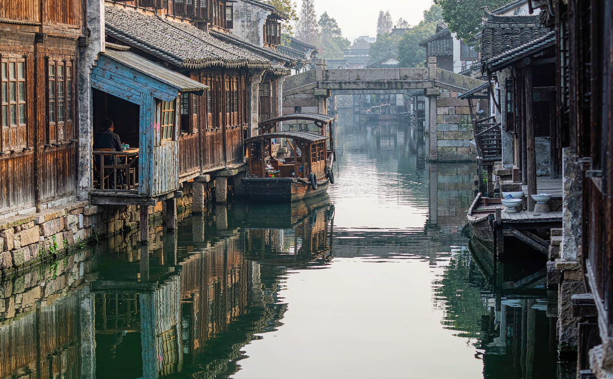 Xitang water town canal with red lanterns at night