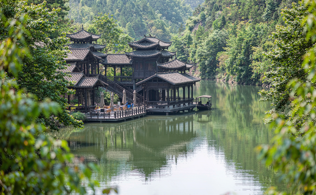The Xiushui River flowing past riverside hills at dawn in Jiangxi