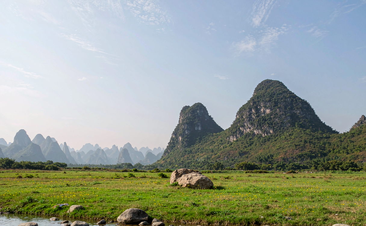 Karst peaks shrouded in morning mist along the Li River in Yangshuo, Guangxi, China