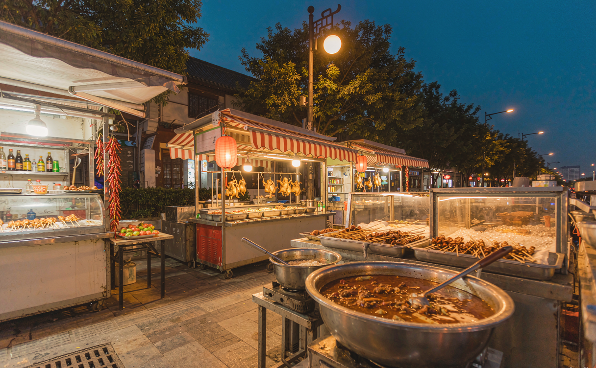 Yiwu riverside evening food stalls on Zongze Road