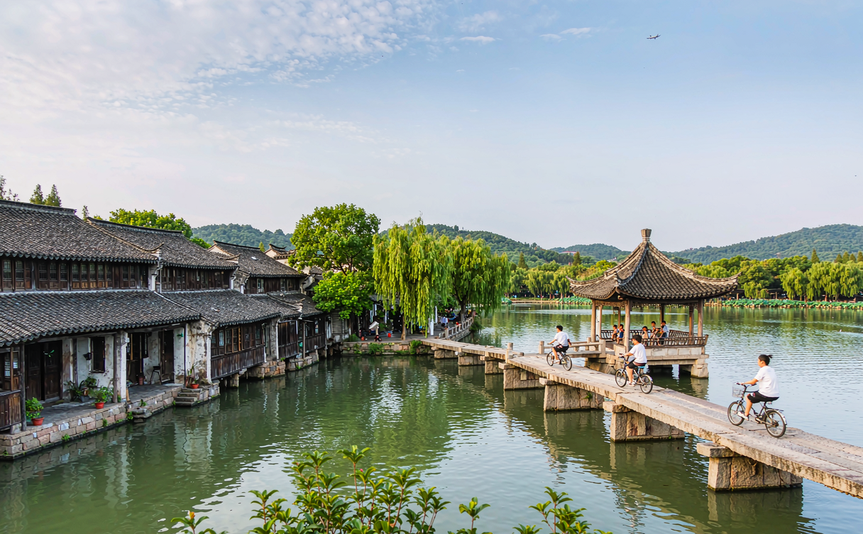 bicycle water town canal China teenager morning