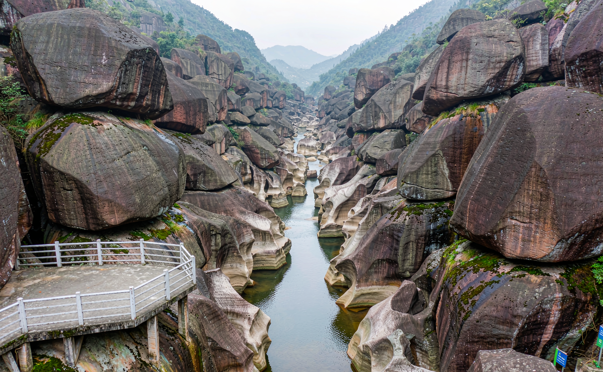 stone boardwalk walkway underneath the tallest waterfall of Dapan Mountain
