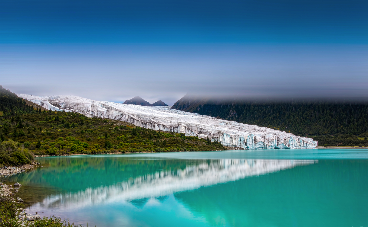 Wide Rawu Lake landscape with glaciers in Tibet, China