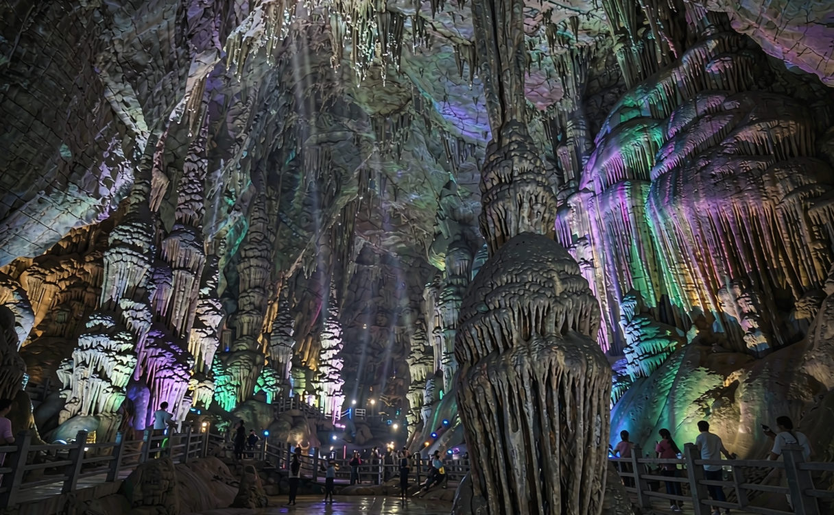 Entrance walkway into the illuminated limestone chambers of Yaolin Cave in Tonglu